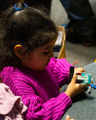 Child at the LEGO build tables