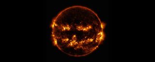 Active regions on the sun combined to look something like a jack-o-lantern’s face on Oct. 8, 2014.