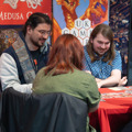 Three adults enjoying a game with Medusa at To Boldly Game