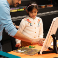 Father and daughter playing a game at To Boldly Game