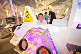 Happy young boy participates in a science experiment on Mars