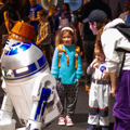 Family meet R2D2 and Chopper at Galactic Gathering