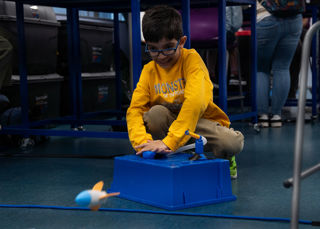 Child launching a rocket at the UK in Space Festival