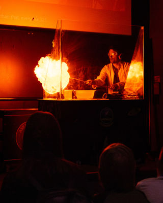 Science Communicator explains rocket propulsion with a large explosion