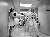 Apollo 10 astronaut Thomas P. Stafford pats the nose of Snoopy who is being held by Jamye Flowers.