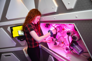 Young girl participates in a science experiment on Mars 