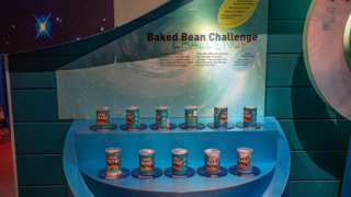 11 weighted baked bean cans show how heavy they would feel on the Sun, Moon and planets as well as Pluto