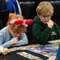 Two children playing a game at To Boldly Game