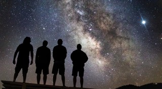 Group of people stargazing.