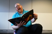 Science Communicator reads a book at Storytime at Small Space Day