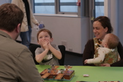 Child holds hands over his mouth whilst laughing at To Boldly Game