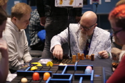 Flav from Hachette demonstrates a game at To Boldly Game