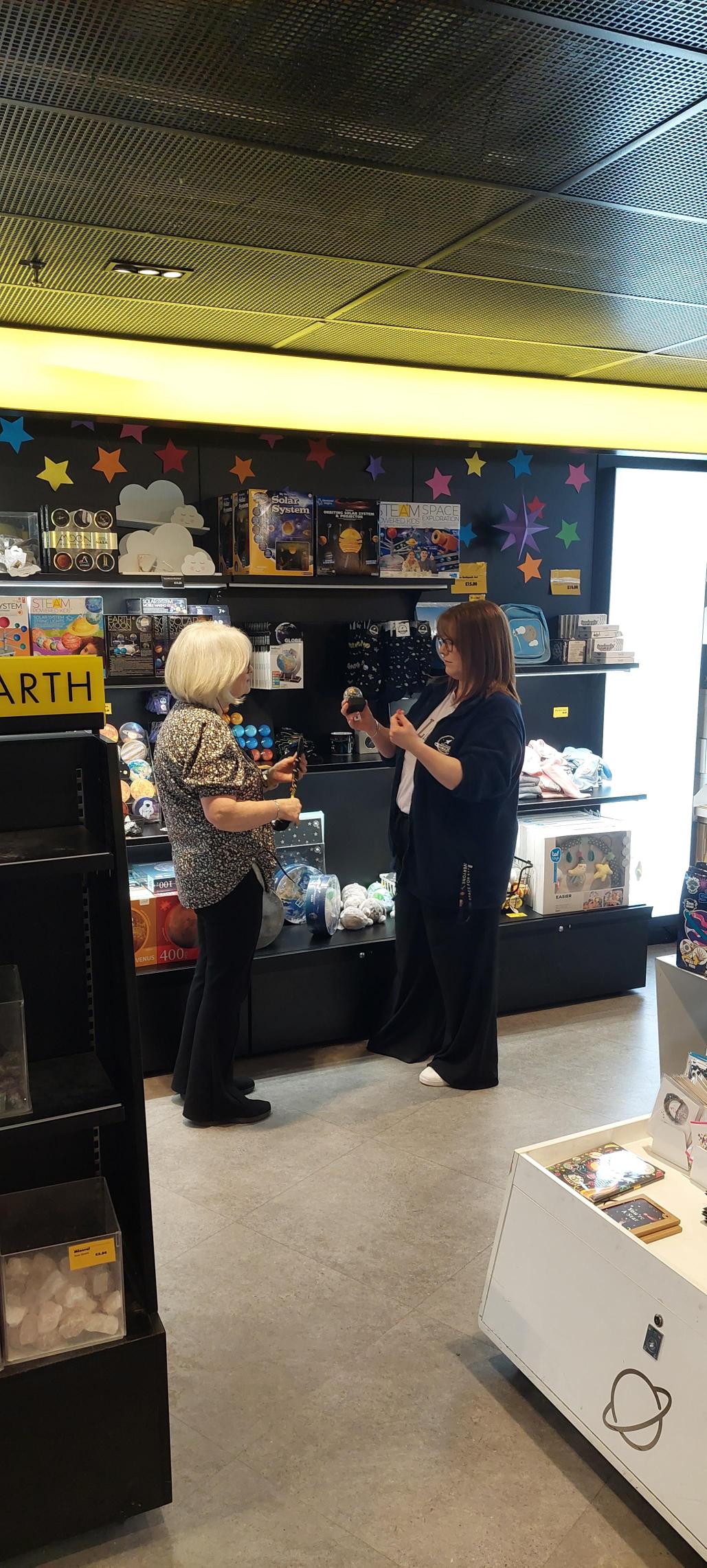 Lisa and Katie Looking at Products