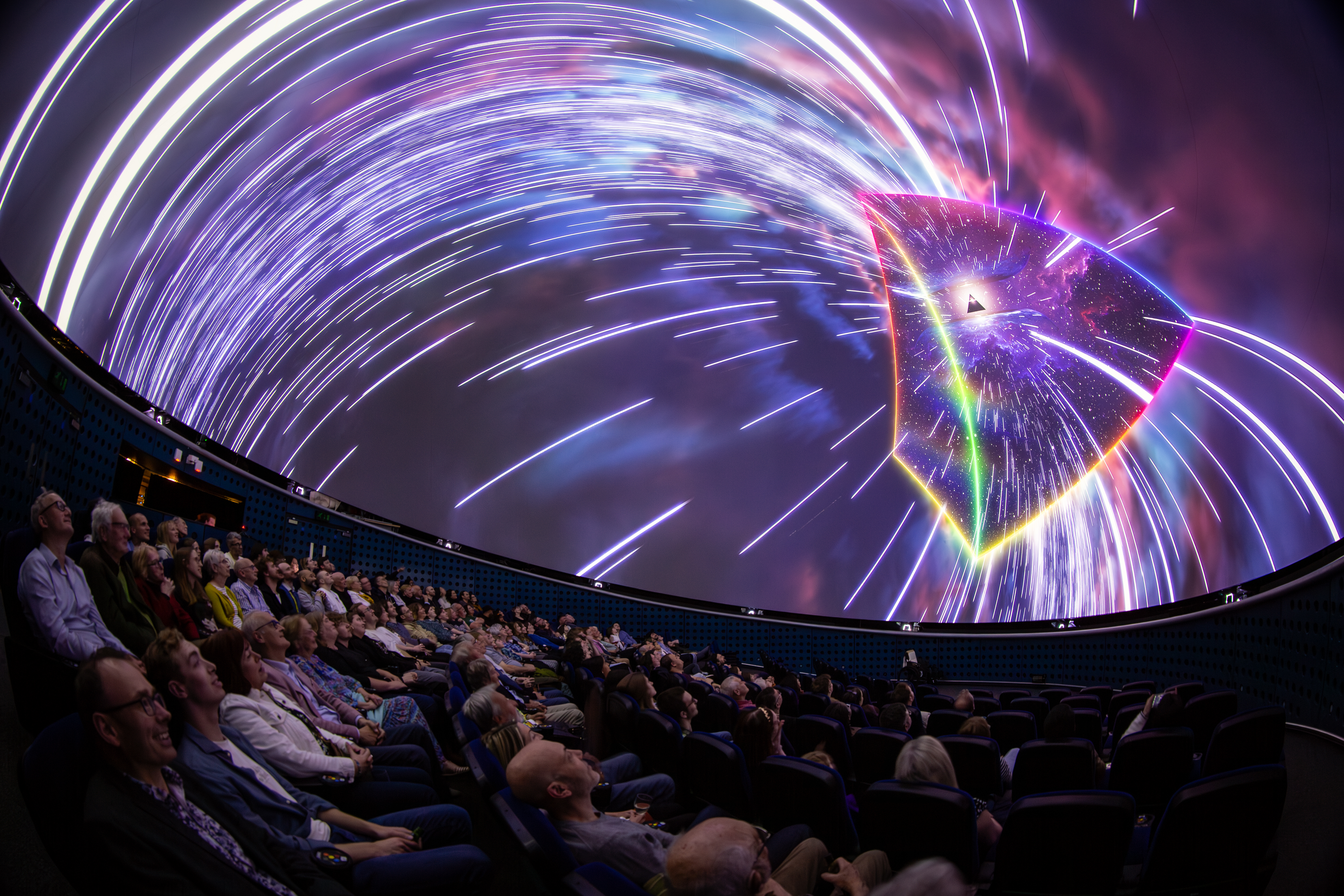 Audience enjoying the fulldome Dark Side of the Moon show in the planetarium