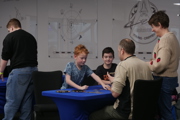 Family with two young boys play a game at To Boldly Game