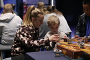 Mother and son playing a game at To Boldly Game