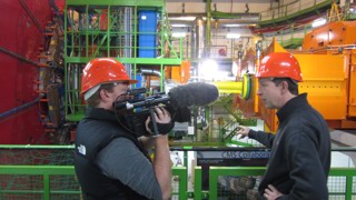 Brady filming with Professor Ed Copeland at the Large Hadron Collider.