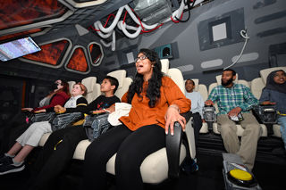 Family enjoying a mission on the Tharsis spacecraft