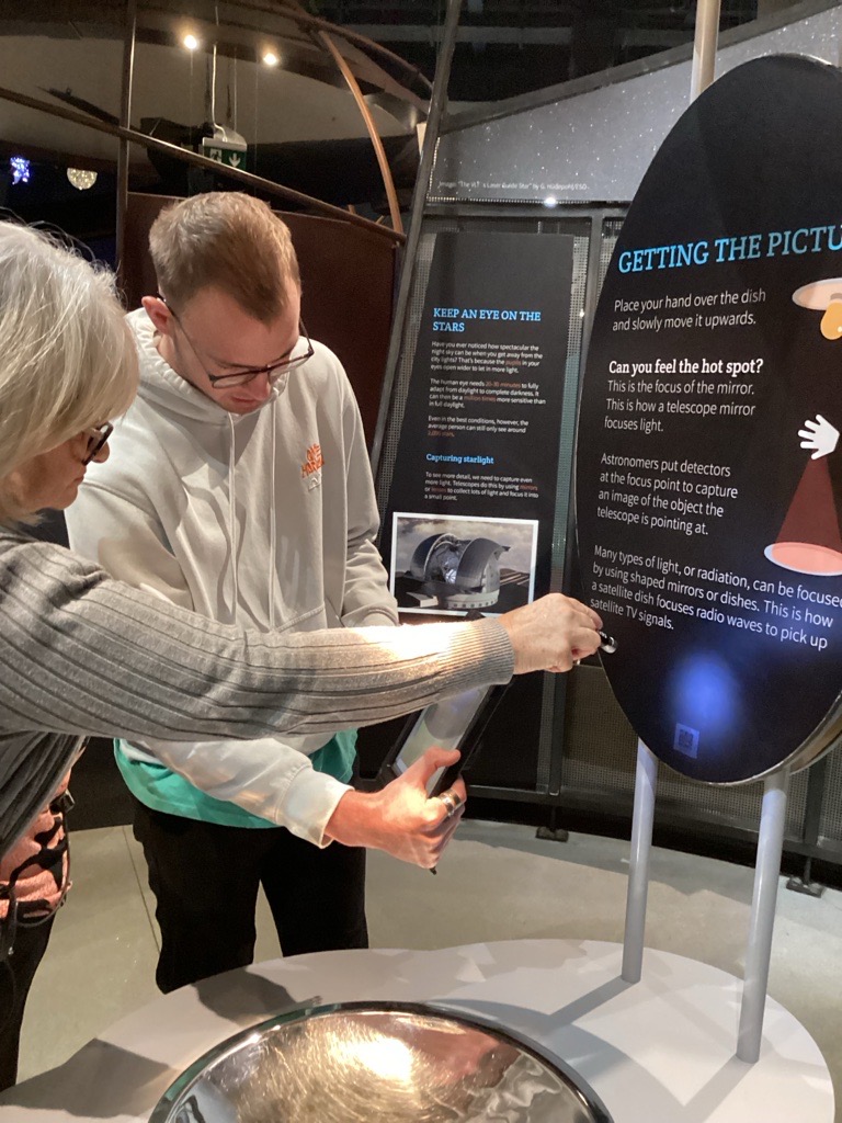 Alex With Lisa Scanning QR Code