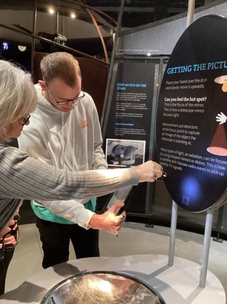 Alex With Lisa Scanning QR Code