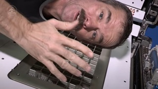 Chris Hadfield at the 'scene of the crime' of his nail clipping felony.