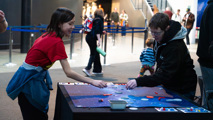 Two young adults playing a game at To Boldly Game