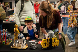 Family looking at LEGO Star Wars display