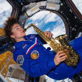 Jessica Meir playing saxophone on the ISS