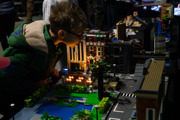 Young boy looks at a spooky night time LEGO building