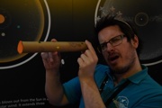 Science Communicator with a telescope made in a craft session at Small Space Day