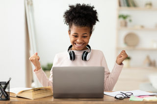 Teenage girl participating in online learning