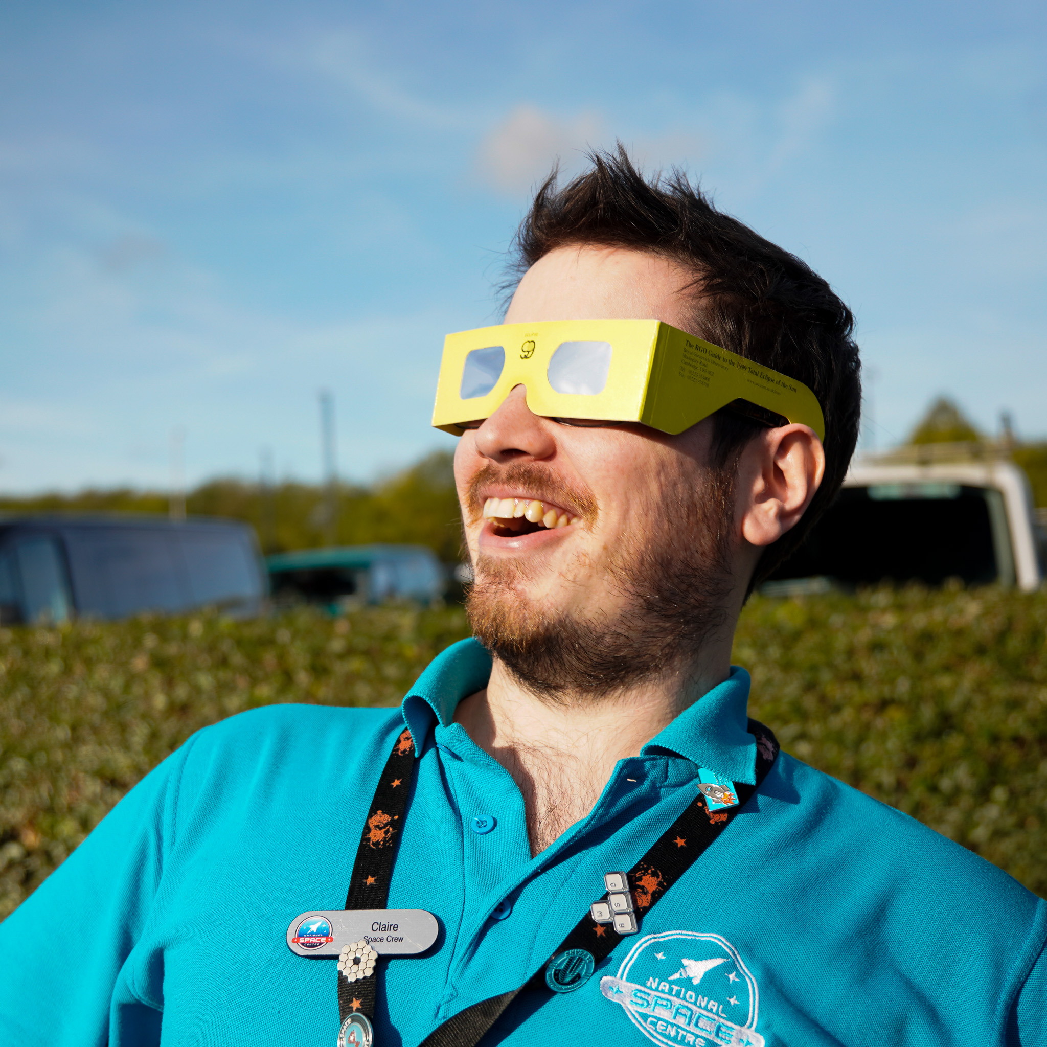 Science Communicator safely watching the solar eclipse using glasses designed for the event