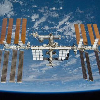 The International Space Station orbiting above the Earth.