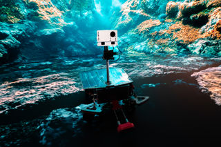 Rover robot visits an underwater world in the immersive room