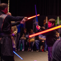 Young boy concentrating at a Lightsaber class at Galactic Gathering
