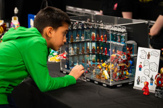Young boy looks at LEGO Ironman display at the Brickish Weekend