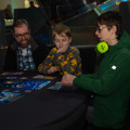 Family playing a game at To Boldly Game