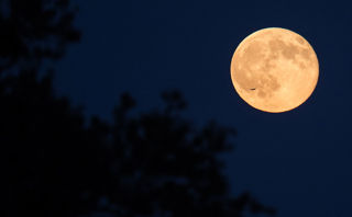 The third full moon in a season with four full moons is called a blue moon.