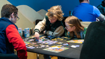 Two children join Alley Cat Games at To Boldly Game