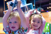 Two small children in Home Planet at Small Space Day