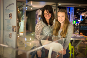 Mother and teen looking at artefacts in Into Space gallery