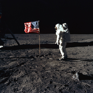 Buzz Aldrin beside the U.S. flag during an Apollo 11 moon walk.