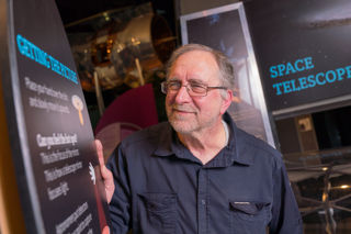 Older man enjoying The Universe gallery